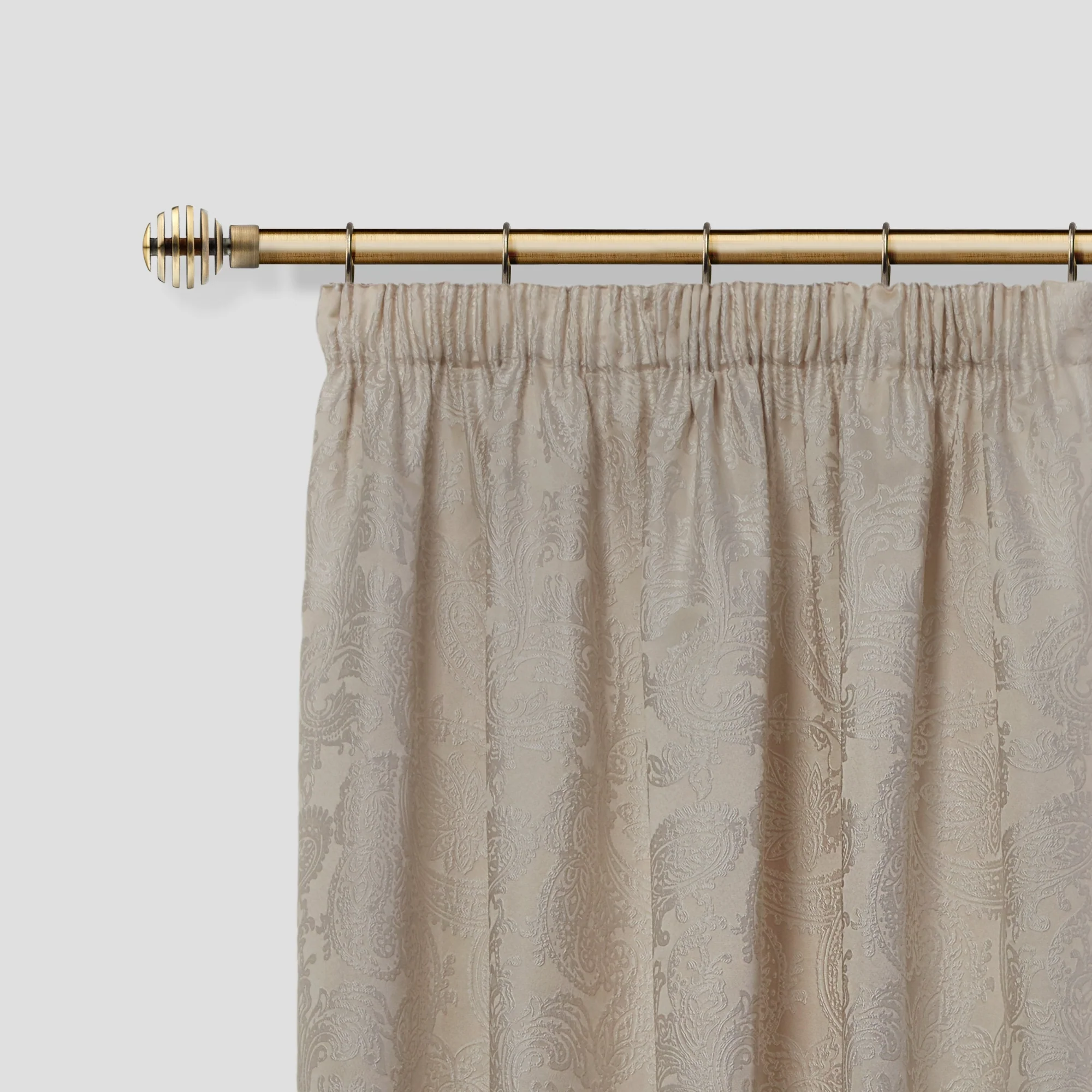 Metal Sliced - Extendable Curtain Pole with rings and pair of end finials in Antique Brass